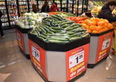 Upon entering the store, customers are greeted by large displays with items that are on promotion. Canadian grown English cucumbers are $1.25 this week.